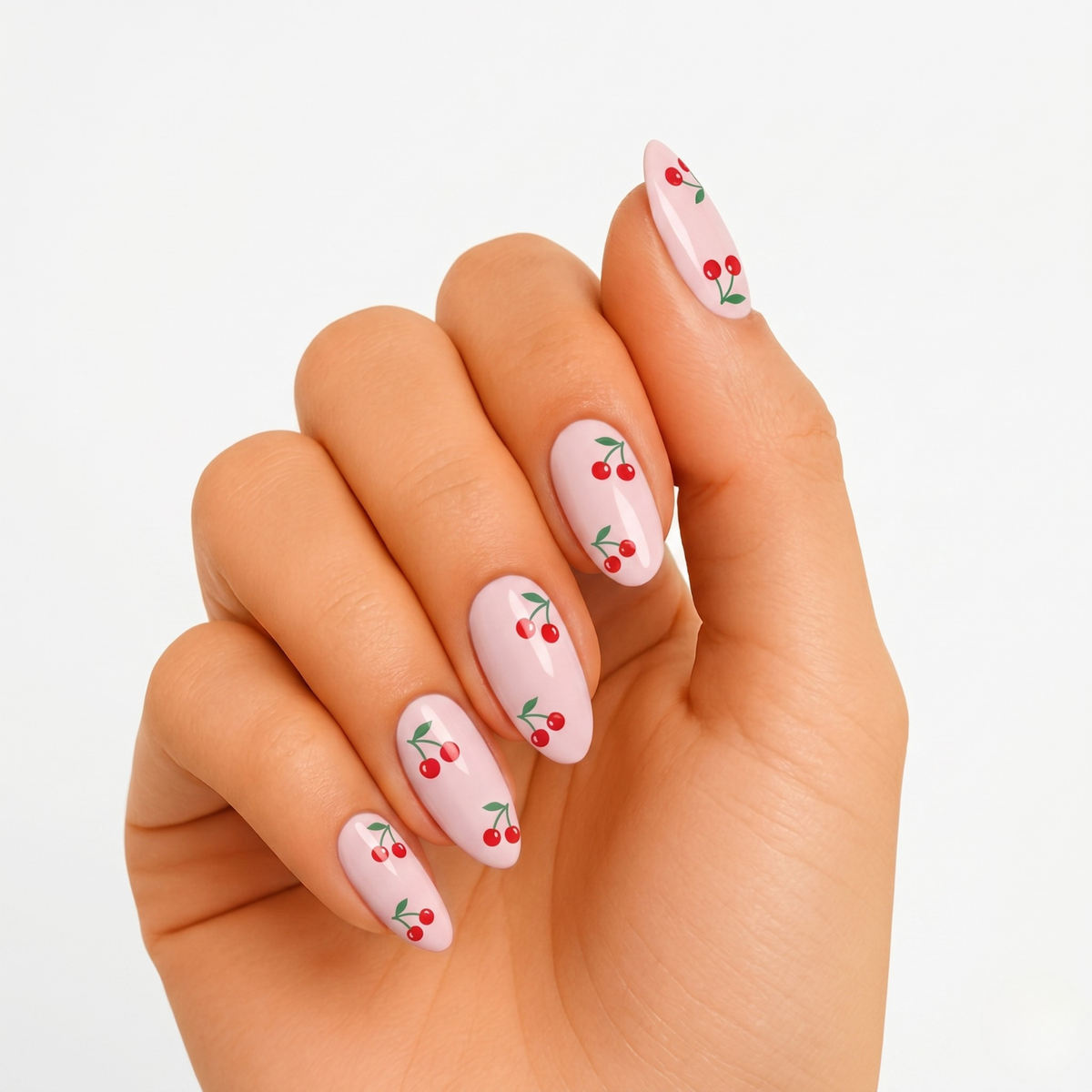 Pale pink glossy nail wraps with red cherry and green leaf print, almond shape