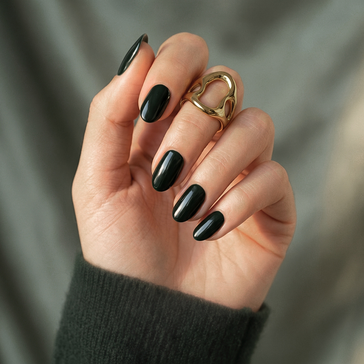 Dark hunter green glossy short oval soft gel press-on nails, high-shine finish.