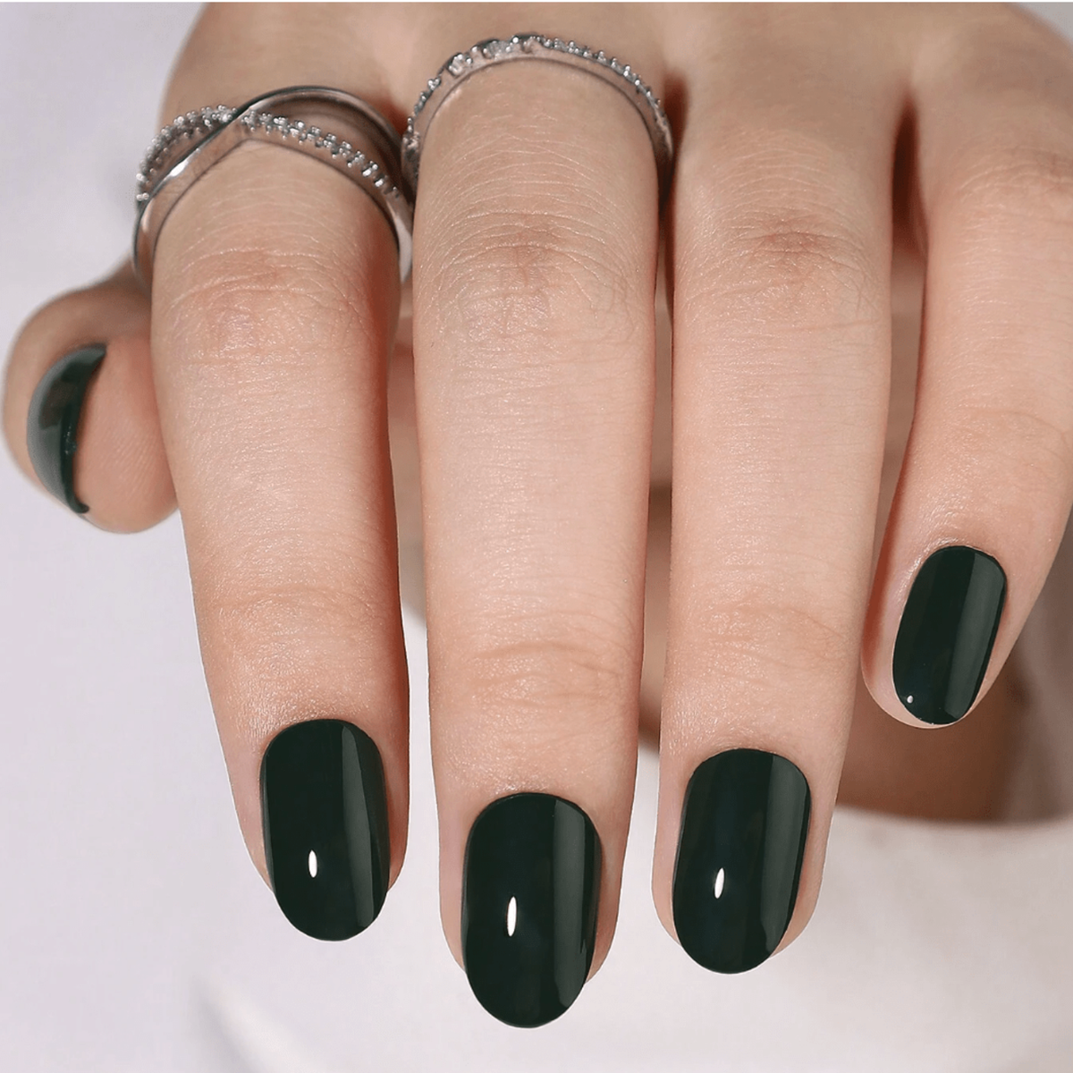 Dark hunter green glossy soft gel press-on nails, short oval shape
