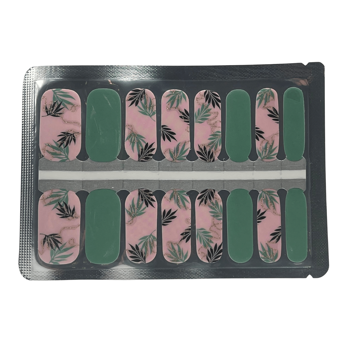 Nail wraps in pink marble with black and green fern leaf print, plus solid green accent nails