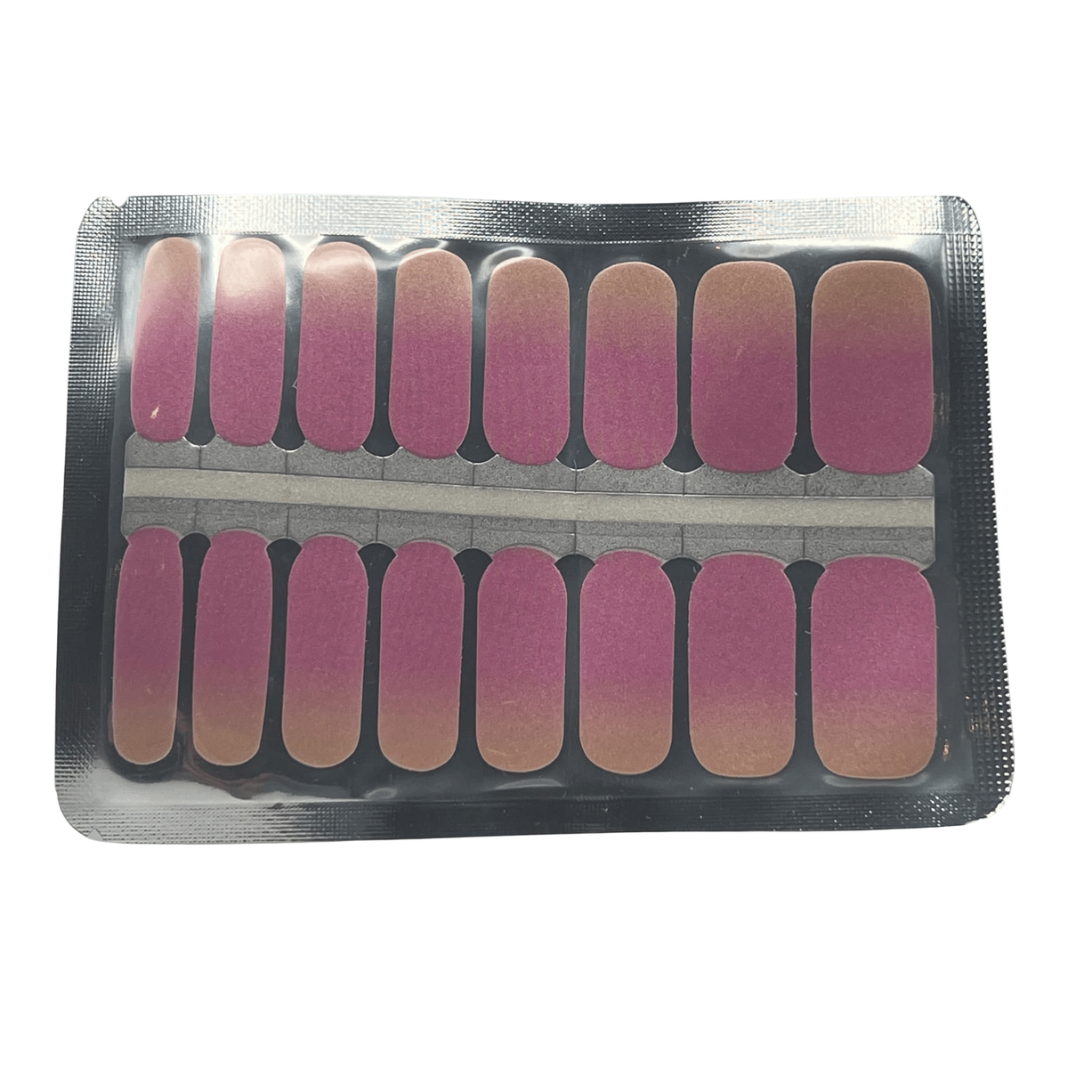 Nail wraps in mauve-pink with shimmering bronze ombré tips, in foil pack
