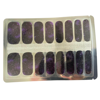 Holy Classics nail wraps in purple and black galaxy design with glittery starry finish