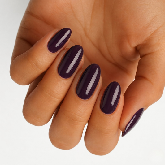 Deep mulberry purple glossy nail wraps on almond-shaped nails