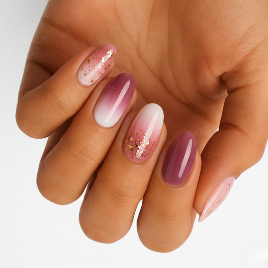 Mauve-pink ombré nail wraps with glossy finish and gold foil flake accents
