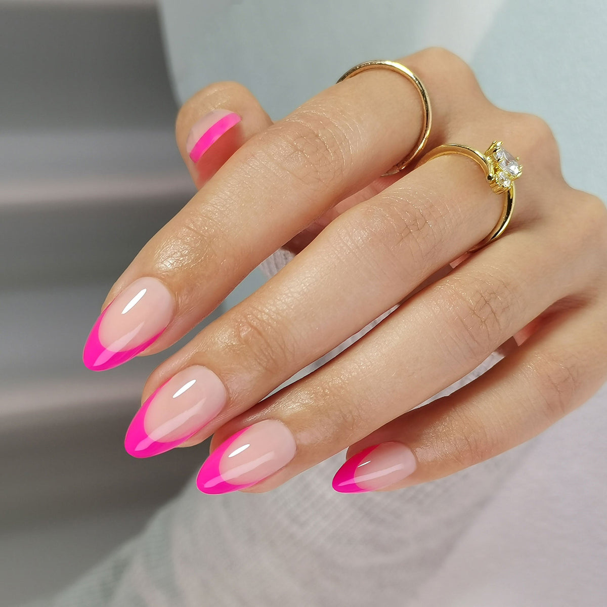Short almond soft gel press-ons, glossy nude nails with hot pink French tips