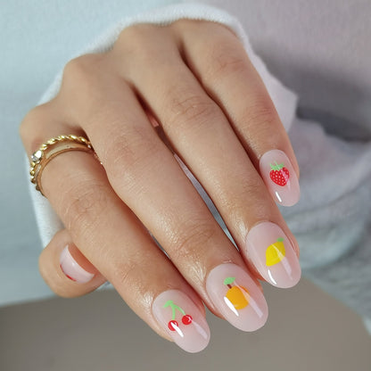 Sheer nude short oval soft gel press-on nails with strawberry, lemon and cherry fruit designs