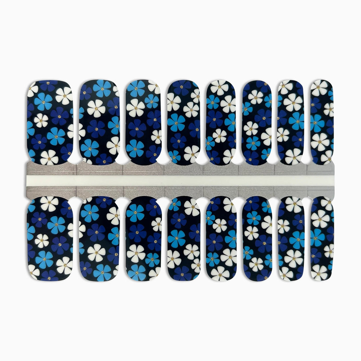 Navy nail wraps with blue and white floral pattern, gold glitter flower centres.