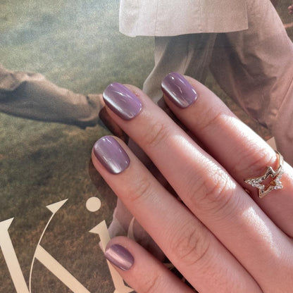 Mauve-purple cat's eye soft gel press-on nails with shimmering metallic effect, extra short natural shape