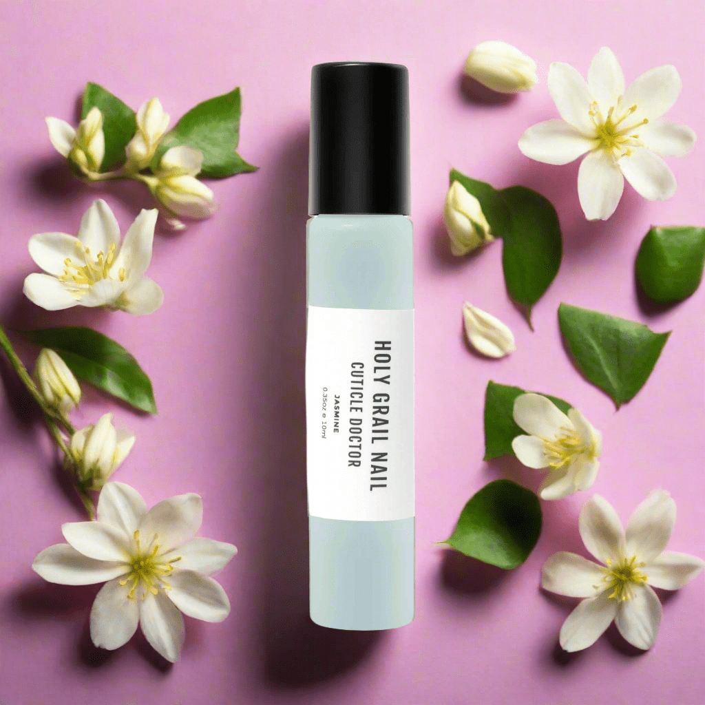 Jasmine cuticle oil pen on pink background with white flowers nail care accessory