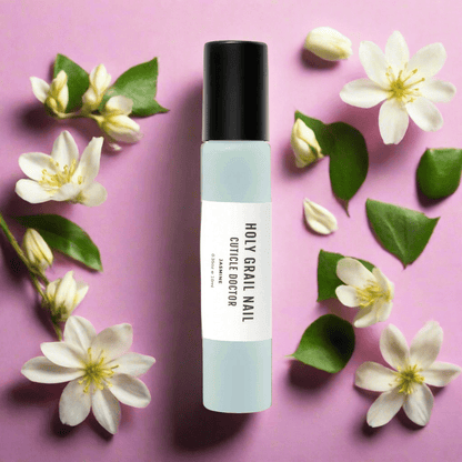 Jasmine cuticle oil pen on pink background with white flowers nail care accessory