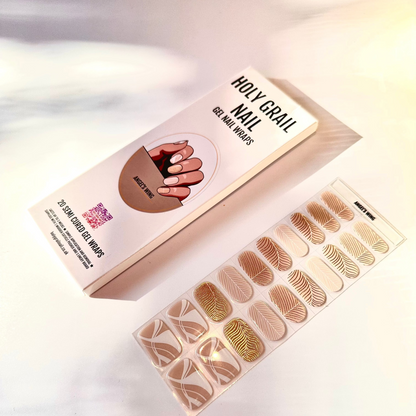Angel's Wing gel nail wraps with gold metallic feather art and packaging display