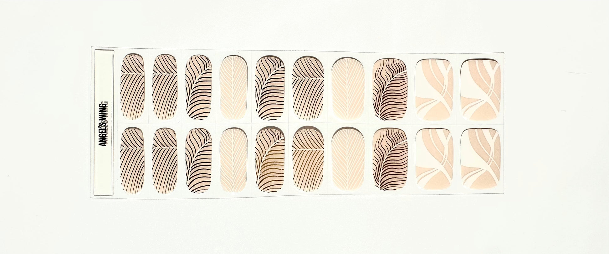 Complete set of champagne gel nail wraps featuring gold feather and geometric nail art