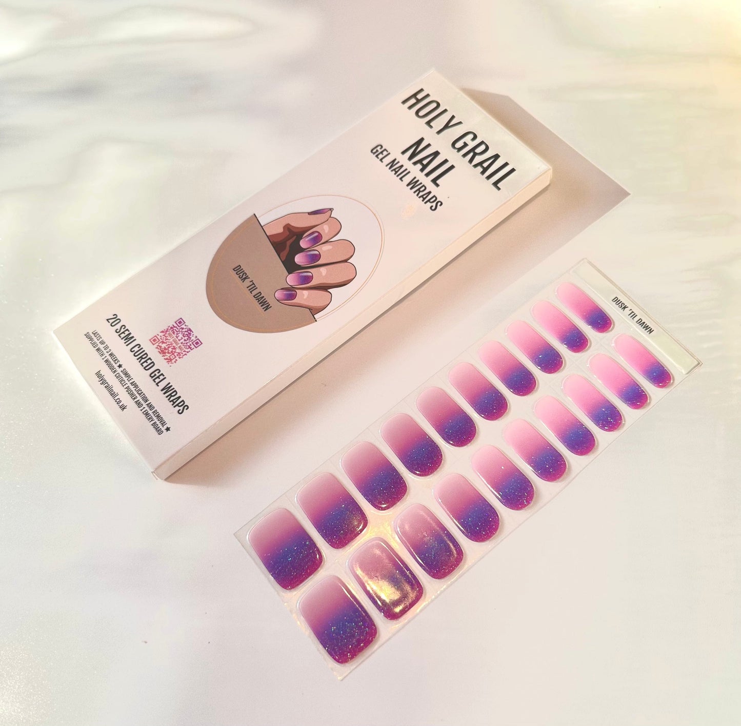Gel nail wraps packaging with purple pink gradient ombre nail strips for at-home manicure