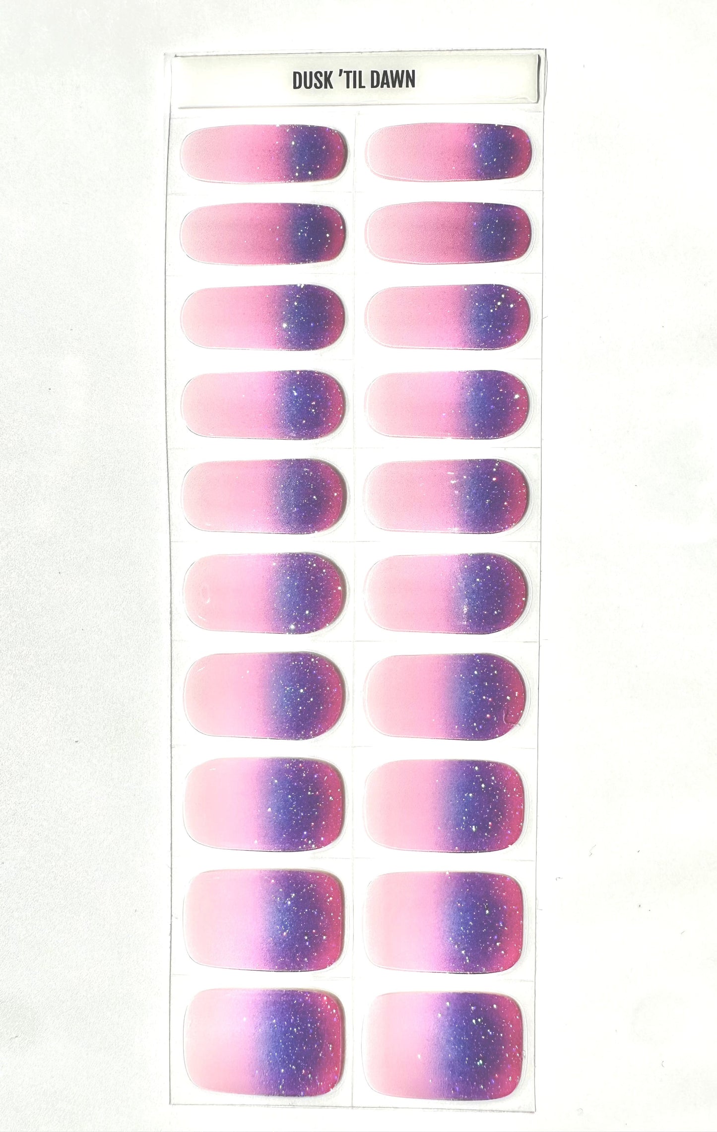 Complete set of purple pink ombre gel nail strips with glitter gradient finish