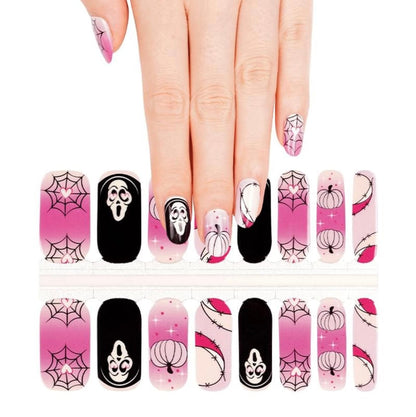 Halloween nail wrap sheet featuring pink spider webs, black ghosts, gothic patterns for spooky manicure