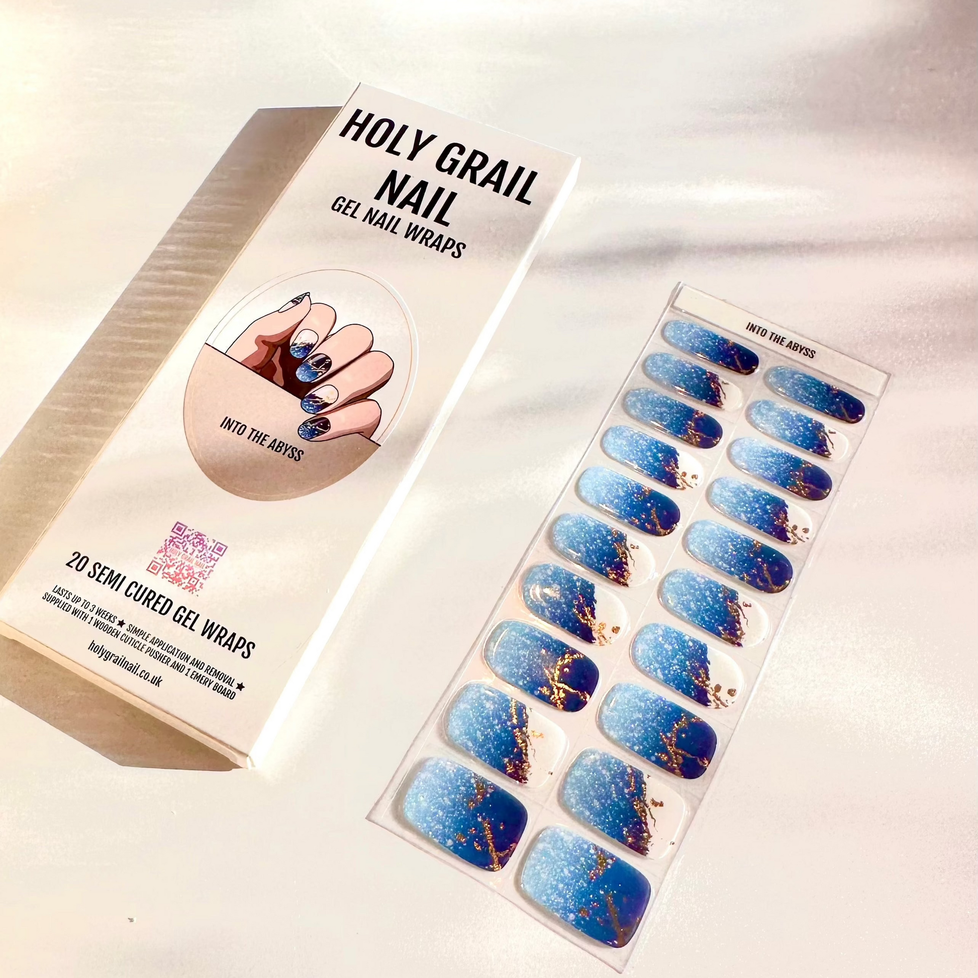 Semi-cured gel nail wraps packaging with blue marble and gold veined nail art design