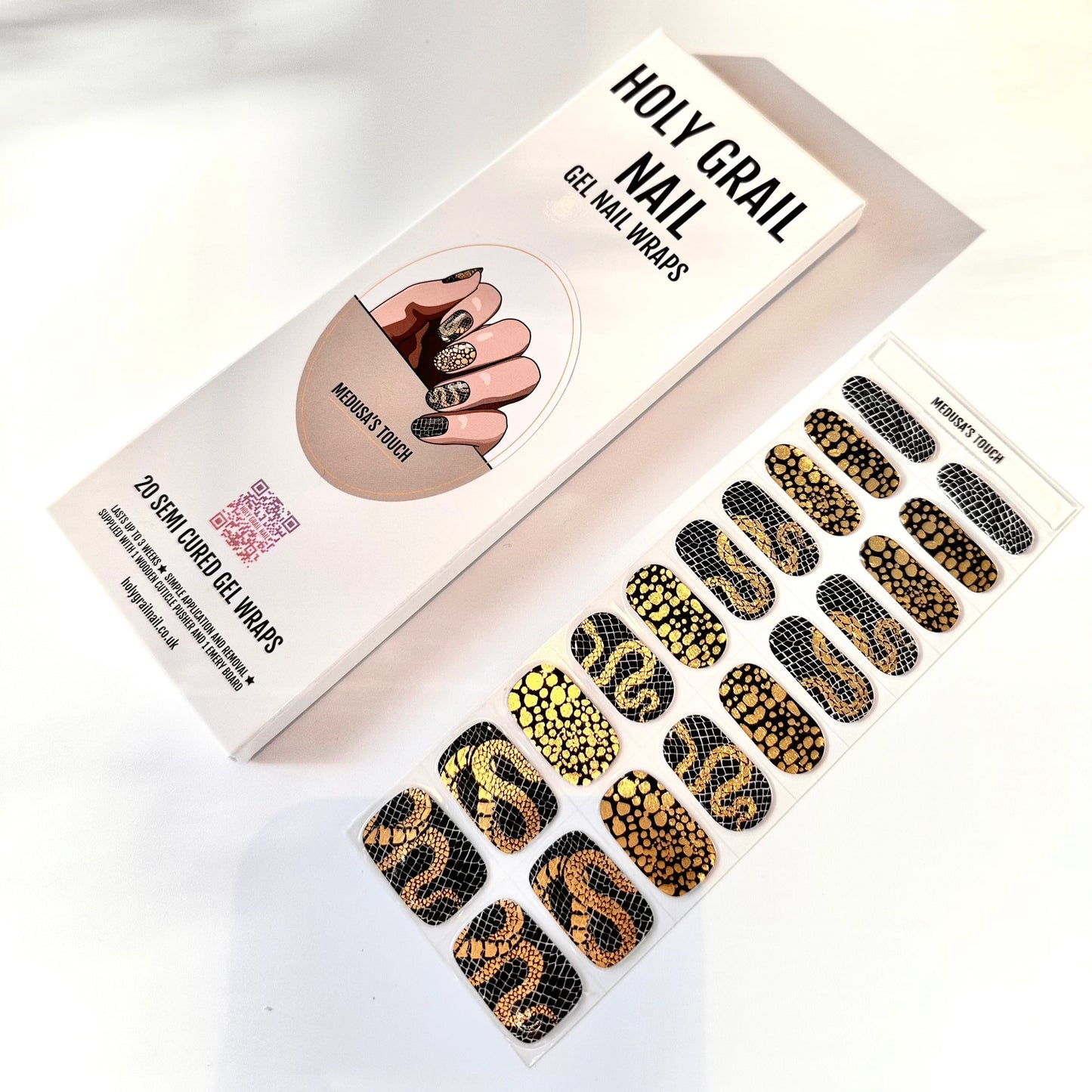 Black and gold snake scale gel nail wraps packaging with textured serpentine patterns