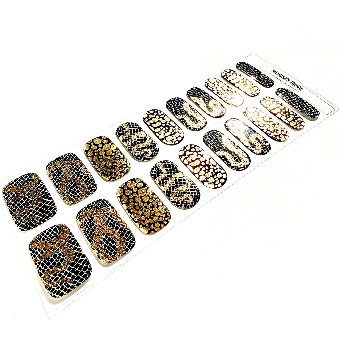 Gold and black textured gel nail wraps with metallic snake scale finish