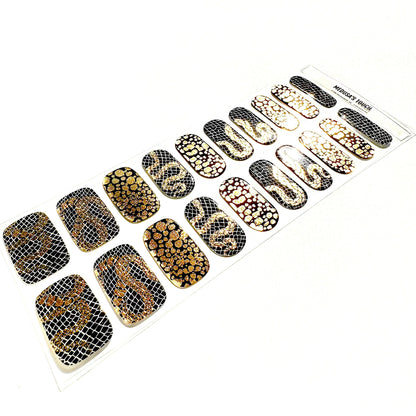 Gold and black textured gel nail wraps with metallic snake scale finish