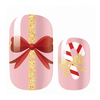 Kids Christmas nail wraps with pink ribbon bow and candy cane glitter designs