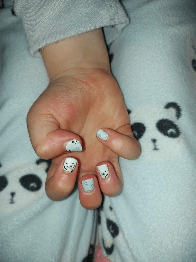 Kids' nail wraps in white with panda faces and bamboo leaf design