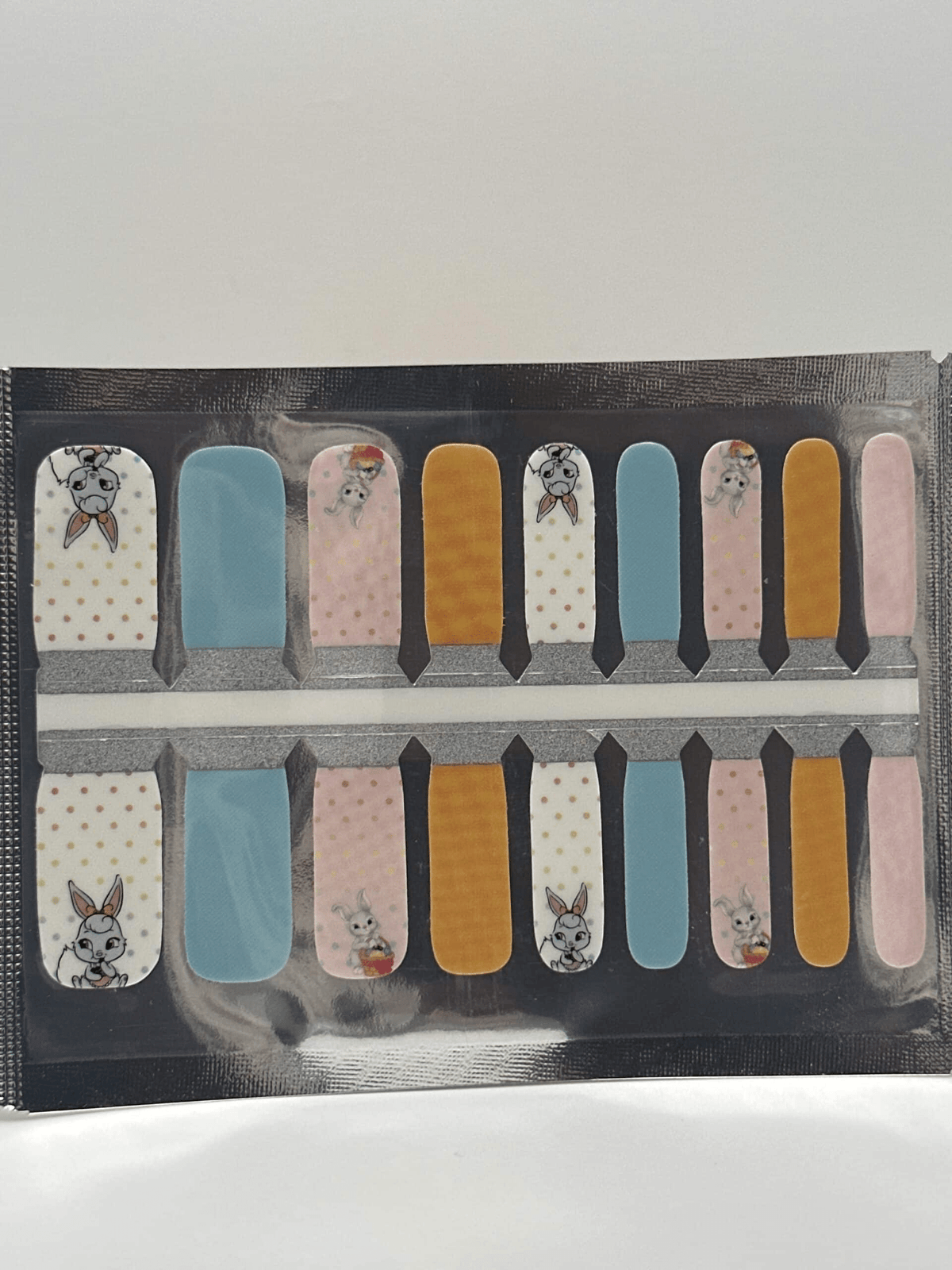 Complete sheet of bunny kids nail wraps featuring cartoon rabbits and colourful designs