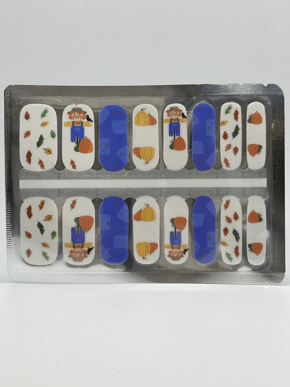 Mini me kids nail wraps sheet showing blue, orange and autumn character designs