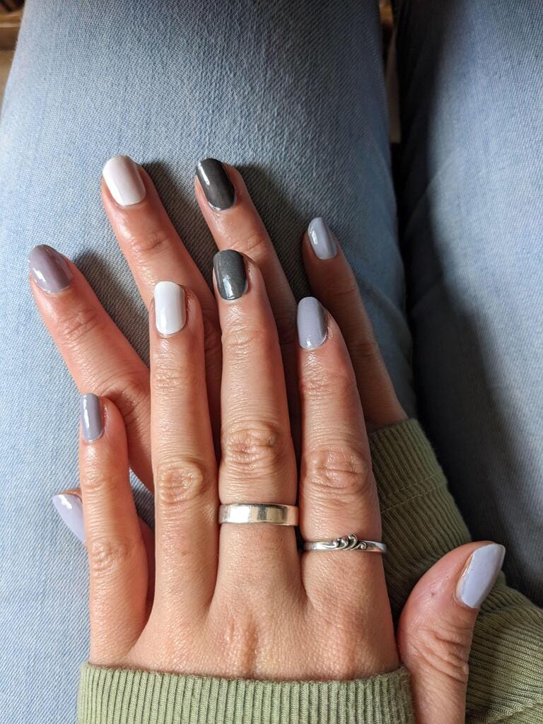 Grey ombre nail art on hands showcasing mixed grey tones classic nail wraps manicure design