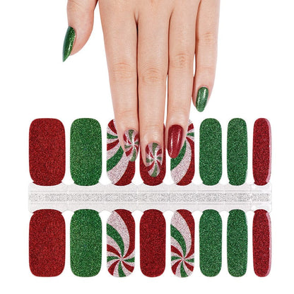 Festive Christmas nail wrap sheet with red green glitter and peppermint swirl patterns