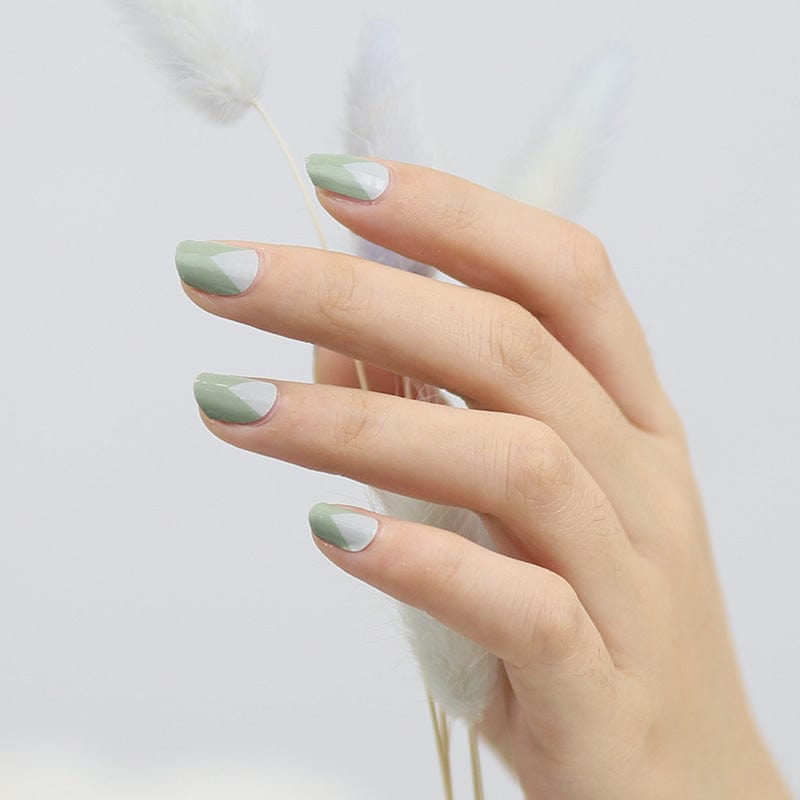 Sage green non-UV nail wraps on hand showing matte finish manicure