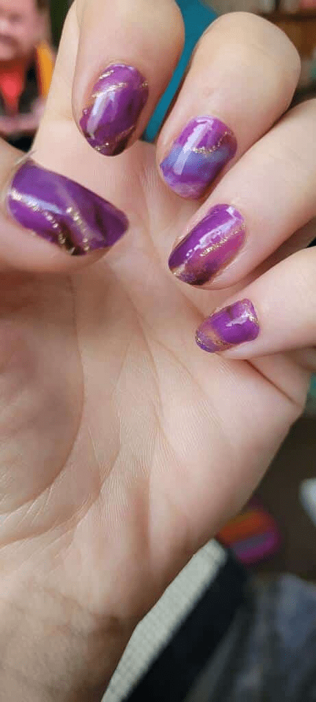 Purple marble nail wraps with gold veining on fingernails at-home manicure look