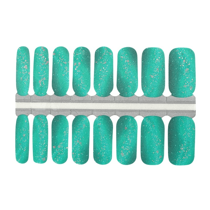 Complete set of turquoise glitter nail wraps arranged in size order for manicure