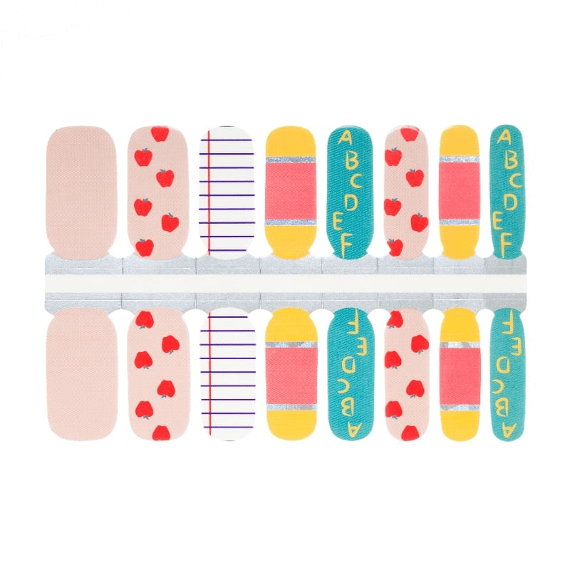 Sheet of teacher-themed nail wraps featuring red apples, stripes, and school patterns