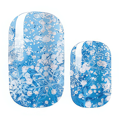 Blue nail wraps with silver frost-like floral pattern and white accent streak