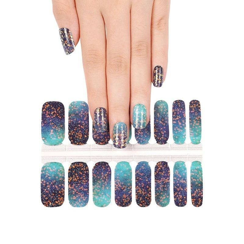 Non-UV nail wraps sheet showing blue teal ombre glitter design with hand wearing manicure