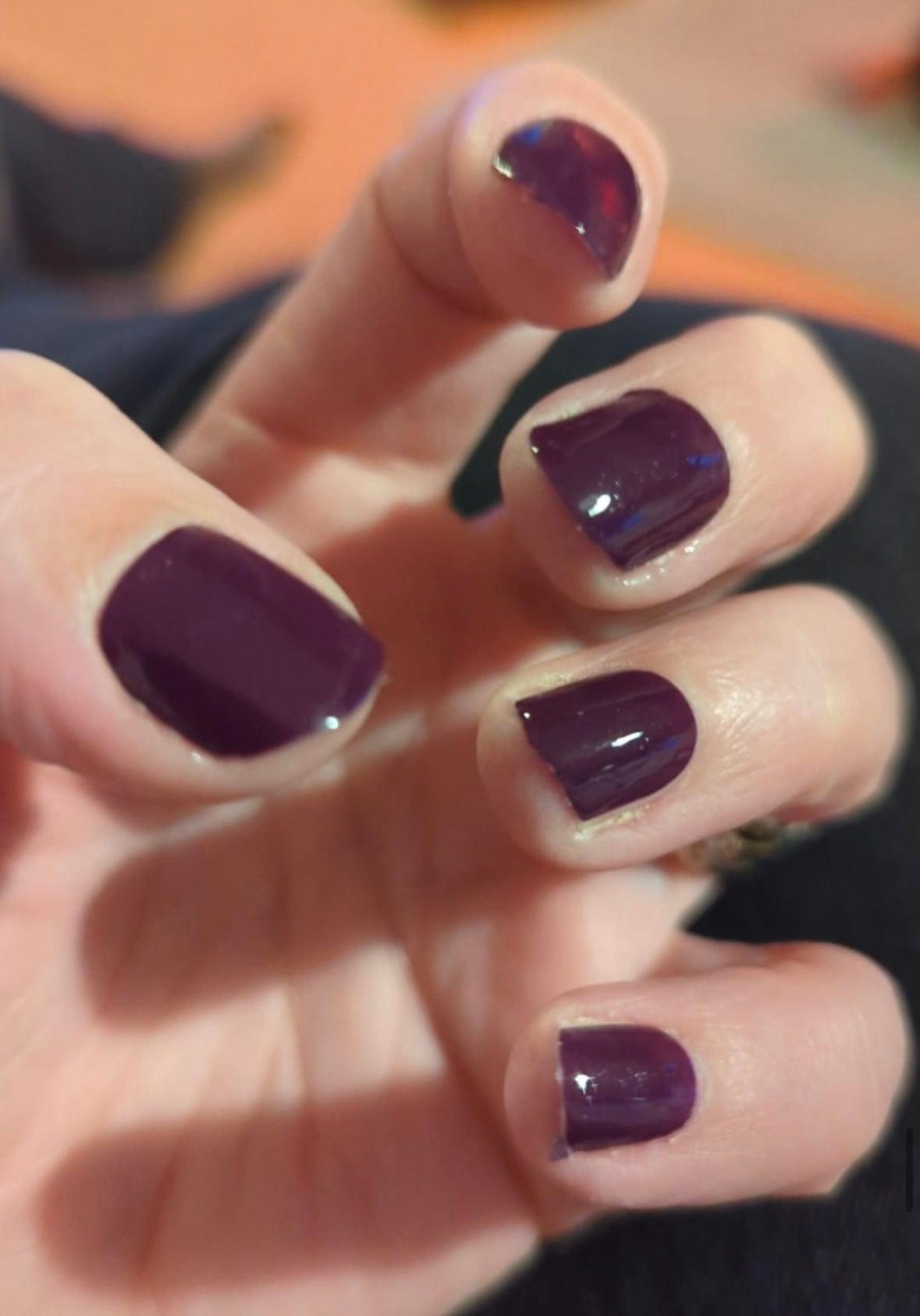 Deep aubergine purple glossy nail wraps on short natural-shaped nails