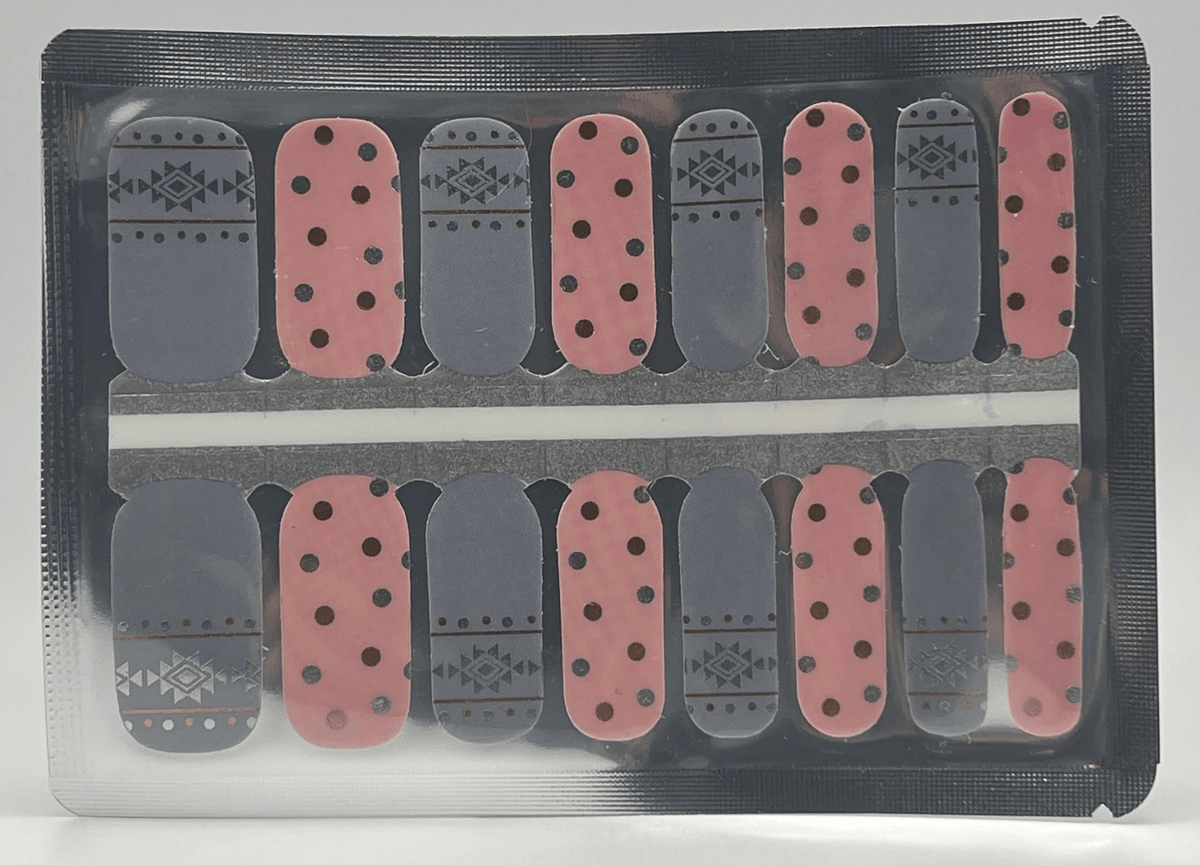 Pink and grey Aztec pattern nail wraps with geometric designs for at-home manicure