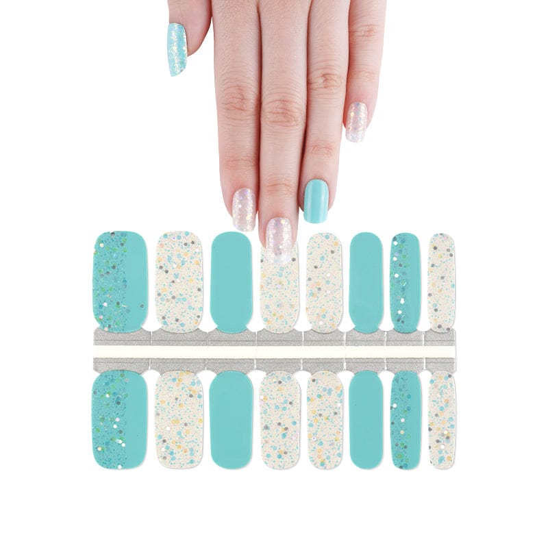 Azure blue and clear sparkly nail wraps sheet with hand model showing turquoise manicure design
