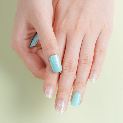 Mint blue and sheer glitter nail wraps with iridescent shimmer accents