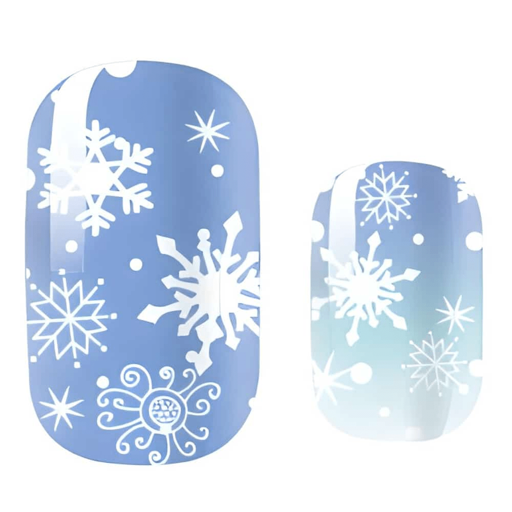 Blue winter nail wraps with white snowflake patterns for festive Christmas manicure design