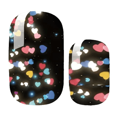 Black nail wraps with colourful heart pattern glitter design for disco party manicure