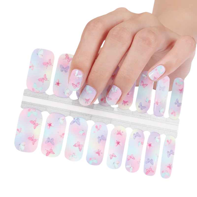 Hand holding pink butterfly nail wraps sheet with gradient background design
