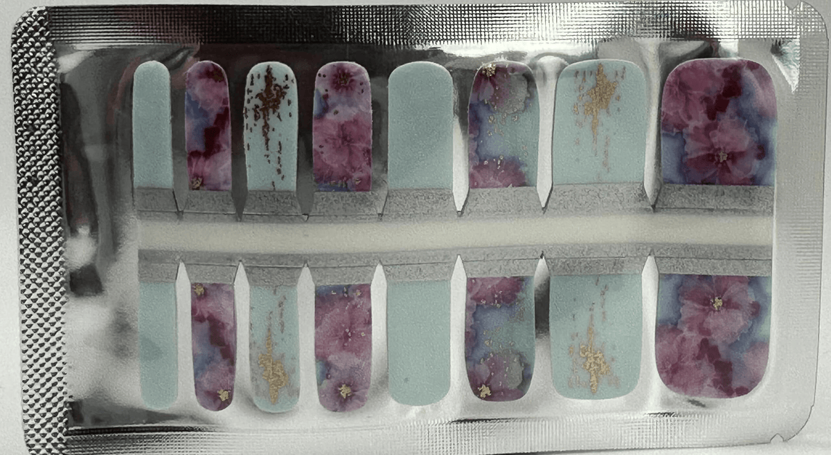 Watercolour floral pedicure nail wraps in blue and purple with gold accents for toe nail art