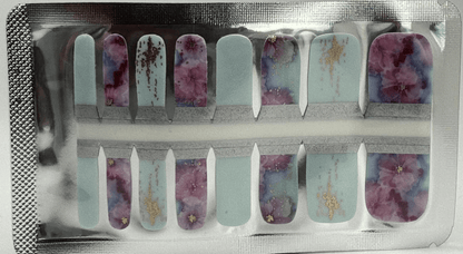 Watercolour floral pedicure nail wraps in blue and purple with gold accents for toe nail art