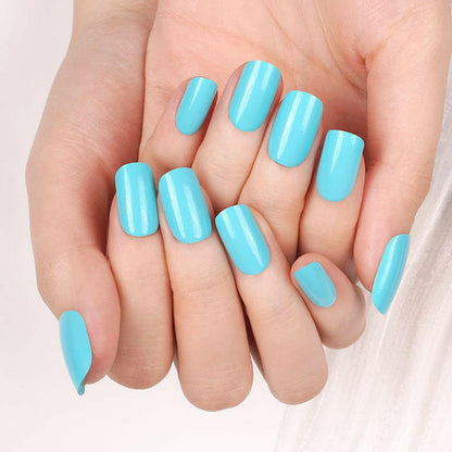 Glossy turquoise blue Holy Classics nail wraps in a solid colour on medium-length nails