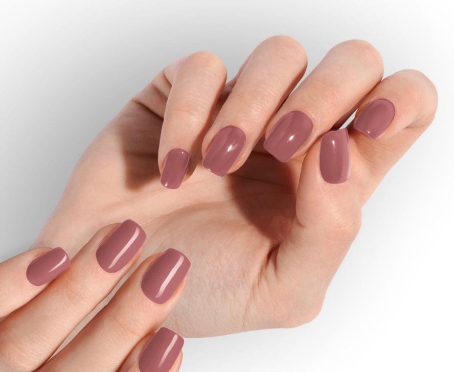 Mauve-pink glossy nail wraps in a solid colour on short square nails