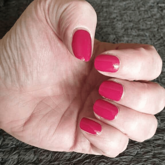 Bougainvillea Holy Classics non-UV nail wraps in glossy magenta-pink on short natural nails