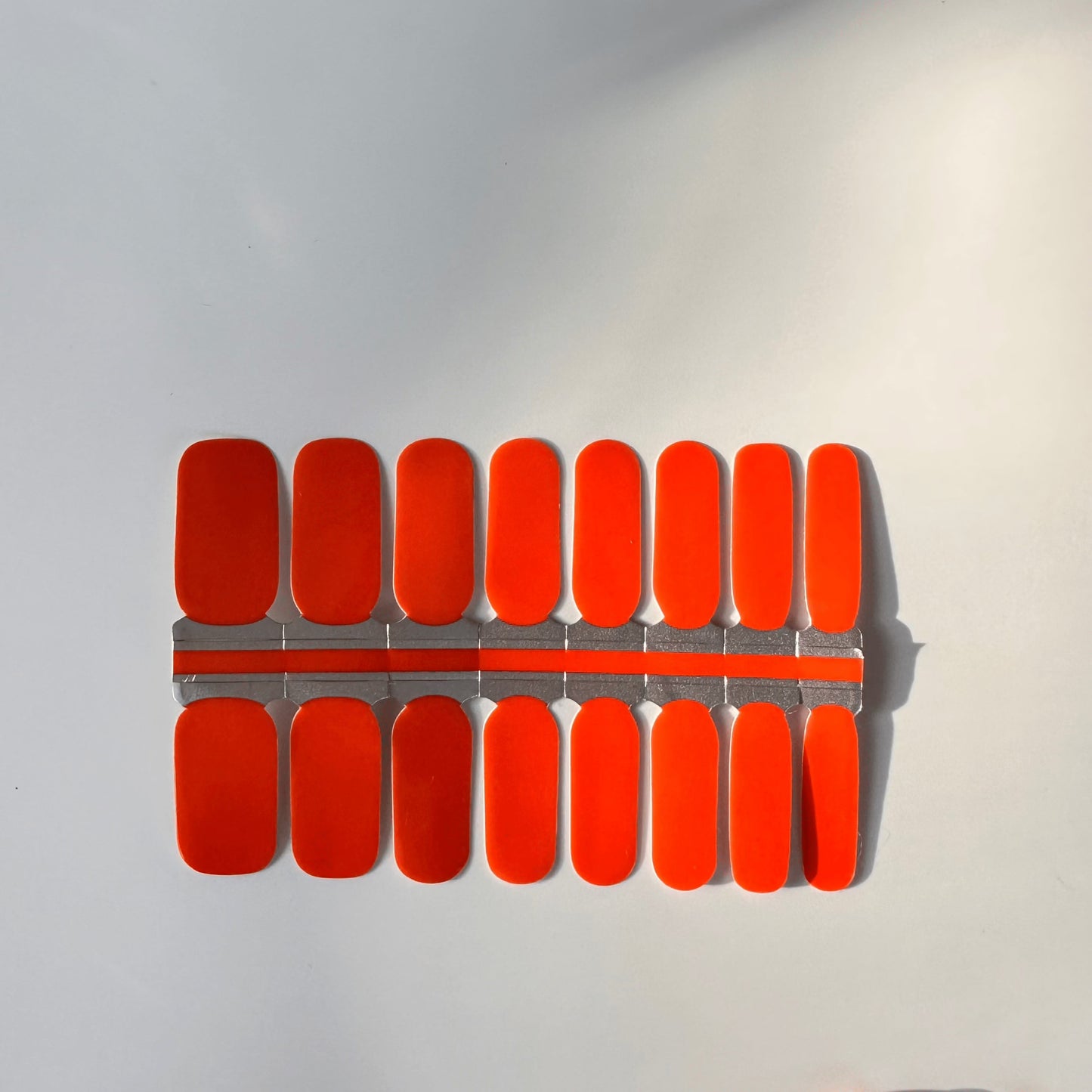 Bright orange red nail wraps sheet showing colour changing manicure design