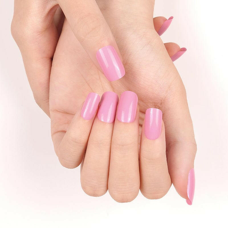 Open palms showing pink glossy nail wraps manicure on all fingernails