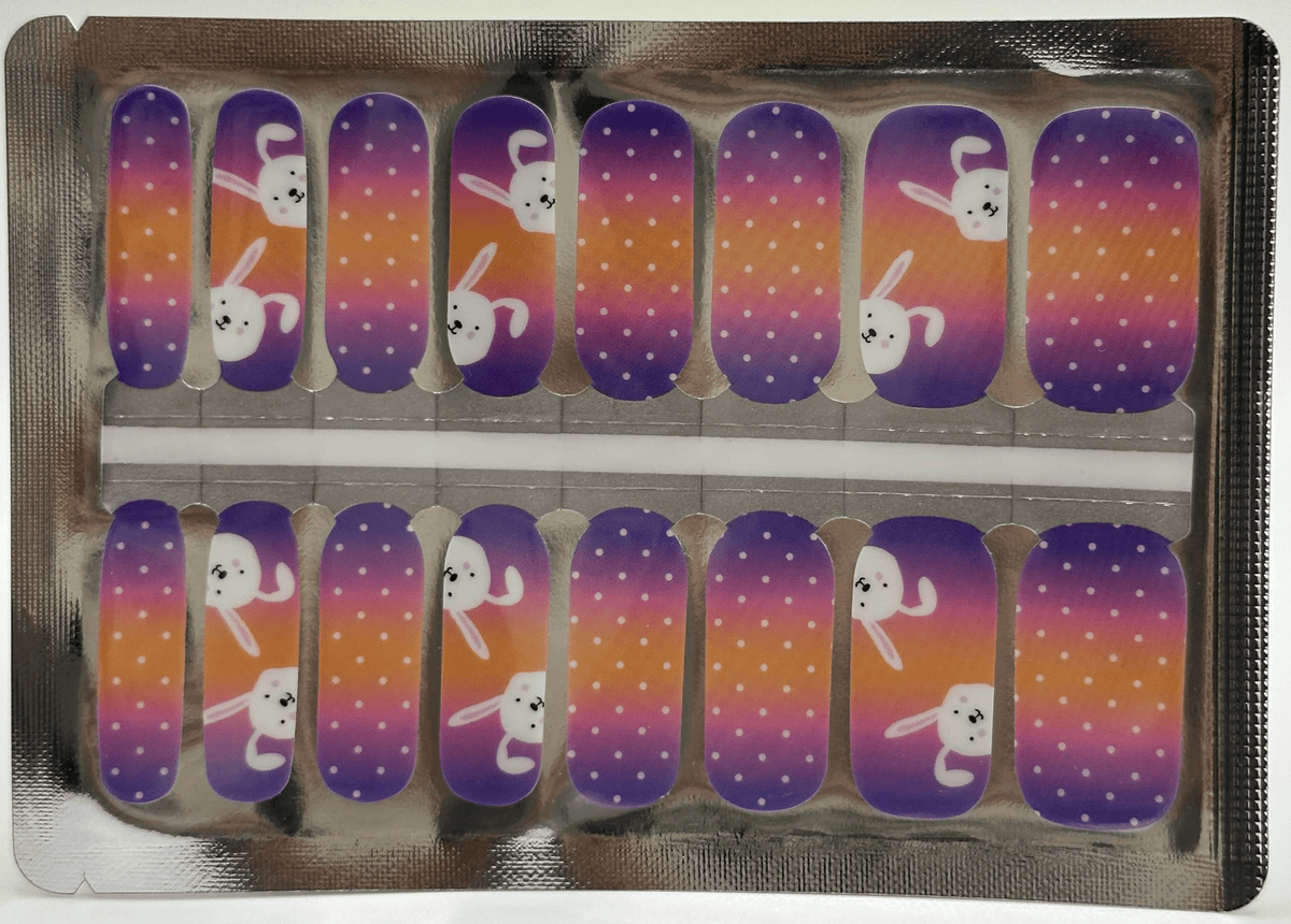 Easter bunny nail wrap strips in purple to orange ombre design